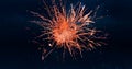 Digital image of red fireworks exploding in the night sky with clouds and stars Royalty Free Stock Photo