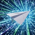 A digital image shows a paper airplane set against a backdrop of streaming binary Royalty Free Stock Photo