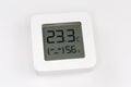 Digital indoor mini thermometer with hygrometer on a white surface