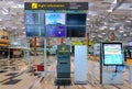 Digital information screens at Changi Airport; flight information panels and navigation booth