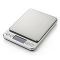 Digital kitchen scale with sleek surface on white background Royalty Free Stock Photo