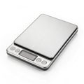 Digital kitchen scale with sleek surface on white background Royalty Free Stock Photo