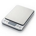 Digital kitchen scale with sleek surface on white background Royalty Free Stock Photo