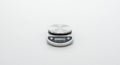Digital kitchen scale on a white surface. Features a round, silver stainless steel weighing Royalty Free Stock Photo