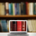 Digital library concept. Modern laptop on table Royalty Free Stock Photo