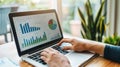 A digital marketer analyzing data on a laptop with graphs