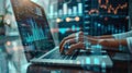 A digital marketer analyzing data on a laptop with graphs