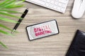 Digital Marketing Advertising technology and business background concept. Mockup smart phone with Digital Marketing word on screen