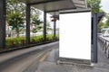 Digital Media blank advertising billboard in the bus stop, blank billboards public commercial with passengers, signboard for Royalty Free Stock Photo