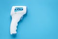 Digital medical infrared forehead thermometer gun non contact for measuring temperature, for coronavirus COVID-19 testing. Blue Royalty Free Stock Photo