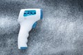 Digital medical infrared forehead thermometer gun non-contact of measuring temperature, for coronavirus COVID-19 testing. Gray Royalty Free Stock Photo