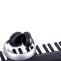 Digital midi keyboard and headphones (blured) Royalty Free Stock Photo