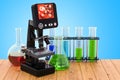 Digital modern microscope with chemical flasks on the wooden ta