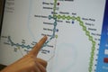 Digital monitor of public transport subway map with finger Royalty Free Stock Photo