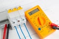 Digital multimeter and circuit breakers with wires Royalty Free Stock Photo