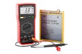 Digital multimeter and Lithium Ion Cell Phone Battery, 3D rendering