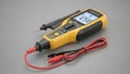 Digital multimeter with red and black probe cables for electrical testing and measurements Royalty Free Stock Photo