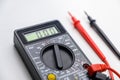 Digital multimeter on a white background. Tool for testing electrical equipment and electrical circuits