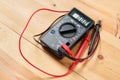 Digital multimeter and wiring on wooden table. special tools of technician for work with circuit and electrical. technician use Royalty Free Stock Photo