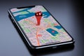 Digital navigation Smartphone display with 3D red map pointer icon