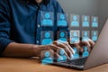 Digital Networking Interface with Highlighted User Icon and Laptop Typing Royalty Free Stock Photo
