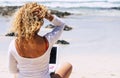 Digital nomad happy lifestyle and people smart working everywhere with roaming and connection technology - beautiful blonde curly Royalty Free Stock Photo