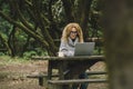 Digital nomad traveler people concept work lifestyle. Alternative outside office in the nature. Pretty woman in smart working on Royalty Free Stock Photo