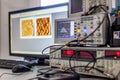 Digital oscilloscope on Desk with computer Royalty Free Stock Photo