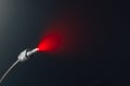 Digital out optical audio cable with jack, red led light in fog Royalty Free Stock Photo