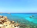 Watercolor seascape. Rocky coastline. Yachts and boats at sea Royalty Free Stock Photo