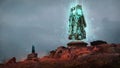 Digital painting of a sci-fi obelisk on a hill with a person wearing a cloak conducting a ritual - Fantasy 3d illustration