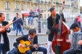 Digital painting style representing a quartet of musicians playing in the streets Royalty Free Stock Photo