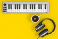 Digital Piano Synthesizer with Headphones and Coffee Cup. 3d Rendering