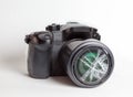 Digital reflex camera with the front lens broken. Royalty Free Stock Photo