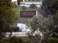 Digital road sign stating Severe Weather Use Caution with a truck passing under it Royalty Free Stock Photo