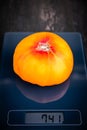 digital scale with orange pineapple tomato on it Royalty Free Stock Photo