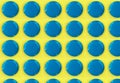 Digital seamless pattern with blue circles on yellow background. Repeating elements