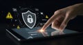 Digital Shield with Padlock on Touchscreen Device in Dark Setting Royalty Free Stock Photo