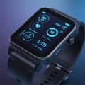 A digital smartwatch with a rectangular face and a black strap is displayed.