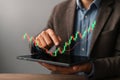 Digital Stock Market Analysis on Tablet with Rising Candlestick Chart Royalty Free Stock Photo