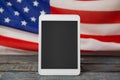 Digital tablet on American flag Royalty Free Stock Photo