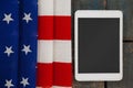 Digital tablet on American flag Royalty Free Stock Photo