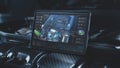 Tablet computer screen shows 3D visualization of car diagnostics software