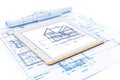 Digital Tablet Displaying BIM Software with Blueprints on Table