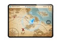 Digital tablet displaying a navigational map with gps tracking and compass overlay Royalty Free Stock Photo