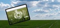 Digital tablet with infographics on a background of agricultural field. Royalty Free Stock Photo