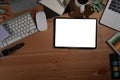 Digital tablet, laptop and supplies on wooden table. Top view. Royalty Free Stock Photo