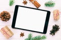 Digital tablet mock up with rustic Christmas wooden background decorations for app presentation. top view with copy space. Toned Royalty Free Stock Photo