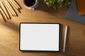 A digital tablet mockup on wooden table background Royalty Free Stock Photo