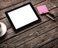 Digital tablet with note paper and cup of coffee Royalty Free Stock Photo